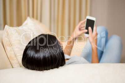 Brunette using smartphone