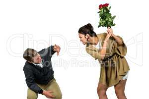 Woman hitting boyfriend with red flowers