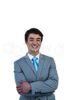 Smiling asian businessman with crossed arms