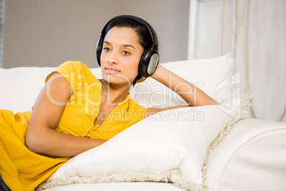 Peaceful brunette with headphones