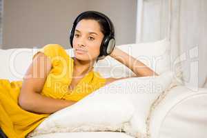 Peaceful brunette with headphones