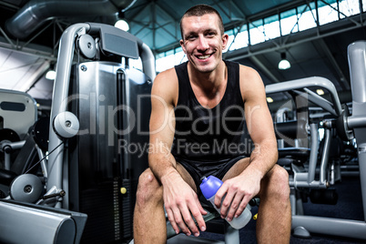 Muscular man smiling at camera