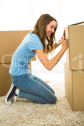 Girl writing on boxes