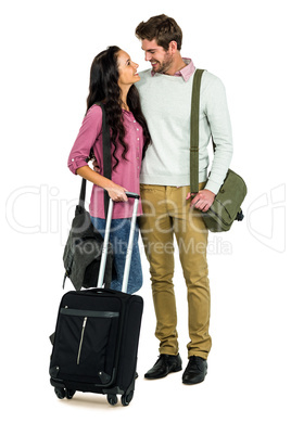 Smiling couple with luggage