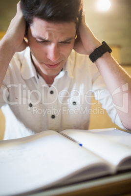 Anxious male student during exam
