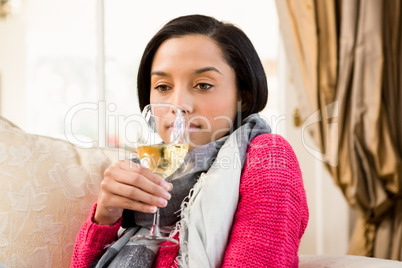 Attractive brunette up to drink white wine