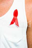 Aids awareness ribbon pinned on vest