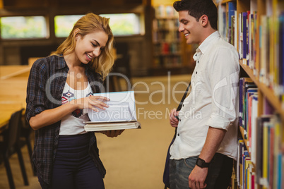 Couple with books looking at each other