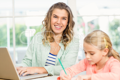 Mother and daughter working