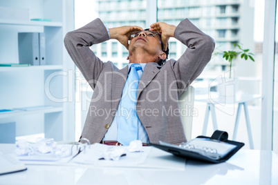 Worried businessman working at his desk