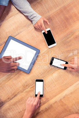 Business people using technologies at table