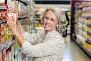 Senior woman buying food at the supermarket