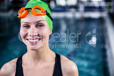 Portrait of a woman swimmer looking the camera