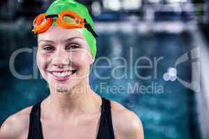 Portrait of a woman swimmer looking the camera