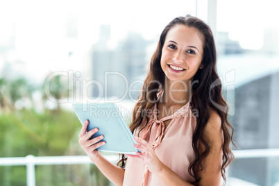 Happy woman using tablet