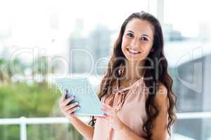 Happy woman using tablet