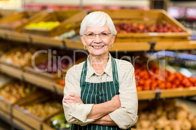 Senior worker with arms crossed