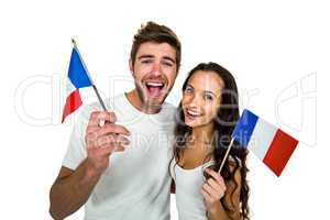 Smiling couple holding French flag
