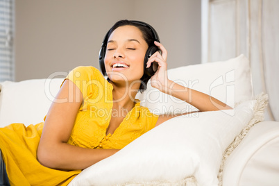 Peaceful brunette with headphones