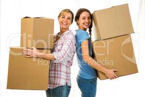 Mother and daughter holding boxes