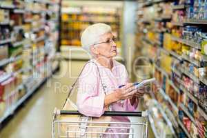 Senior woman with shopping list