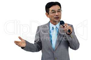 Asian businessman holding microphone