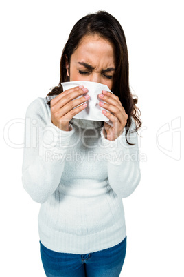 Sneezing woman while standing