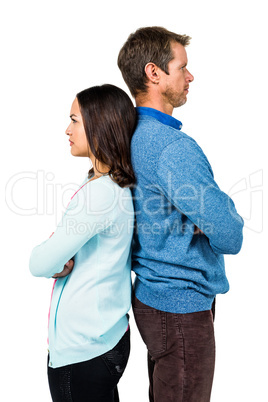 Troubled couple standing back to back