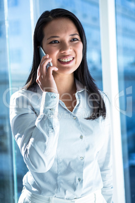 Smiling businesswoman on phone call