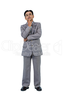 Businessman with hand on chin