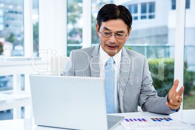 Asian businessman working in his computer