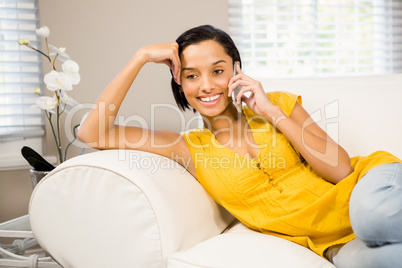Smiling brunette on phone call