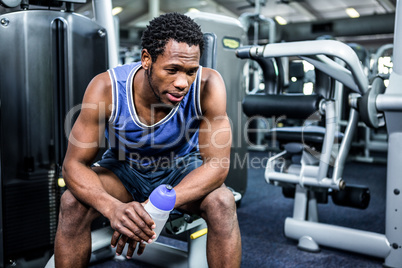 Thoughtful muscular man taking a break