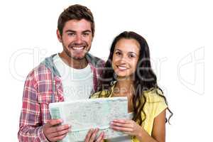 Portrait of smiling couple holding map