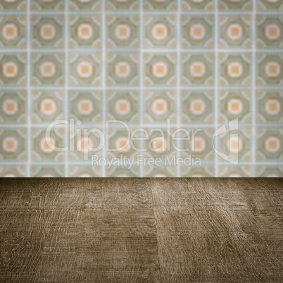 Wood table top and blur vintage ceramic tile pattern wall