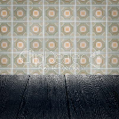 Wood table top and blur vintage ceramic tile pattern wall