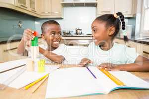 Children doing homework in the kitchen