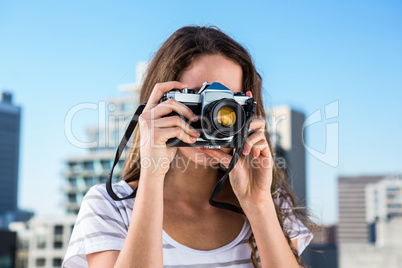 Young girl taking photos