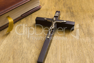 Catholic wooden crucifix and book
