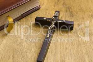 Catholic wooden crucifix and book