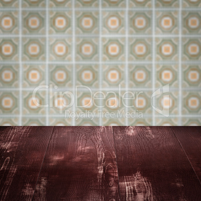Wood table top and blur vintage ceramic tile pattern wall Wood table top and blur vintage ceramic tile pattern wall