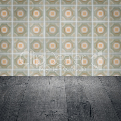 Wood table top and blur vintage ceramic tile pattern wall