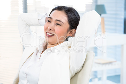 Smiling businesswoman relaxing herself Smiling businesswoman relaxing herself