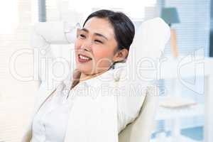 Smiling businesswoman relaxing herself