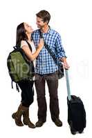 Full length of couple with bags embracing each other
