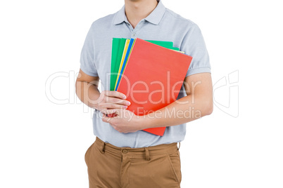 Mid section of man holding files
