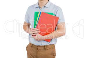 Mid section of man holding files