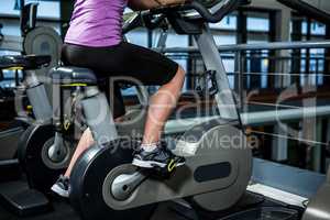 Mid section of woman doing bike exercise