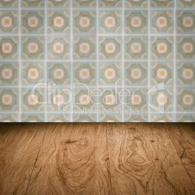 Wood table top and blur vintage ceramic tile pattern wall