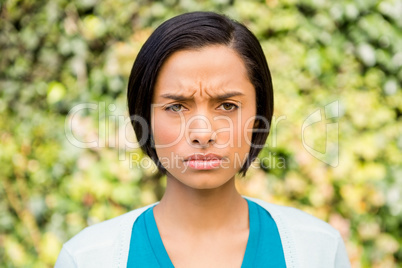 Portrait of frowning brunette